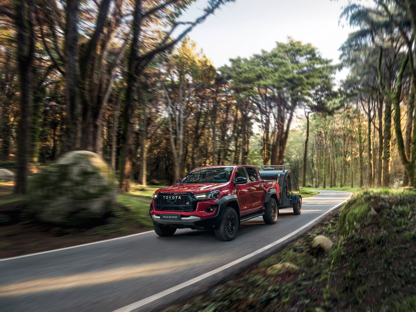Hilux on the road towing an all-terrain caravan